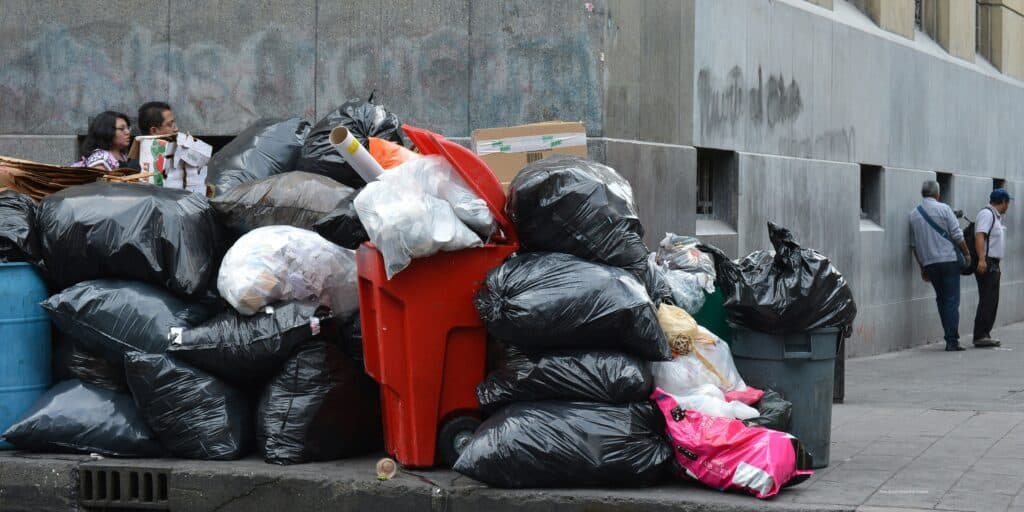 Commercial rubbish piled up on a city street corner