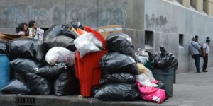 Commercial rubbish piled up on a city street corner